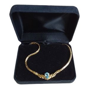 1 Women's Gold Necklace With Blue Stone.
